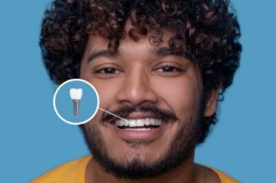 man smiling gently + icon showing the location of his dental implant